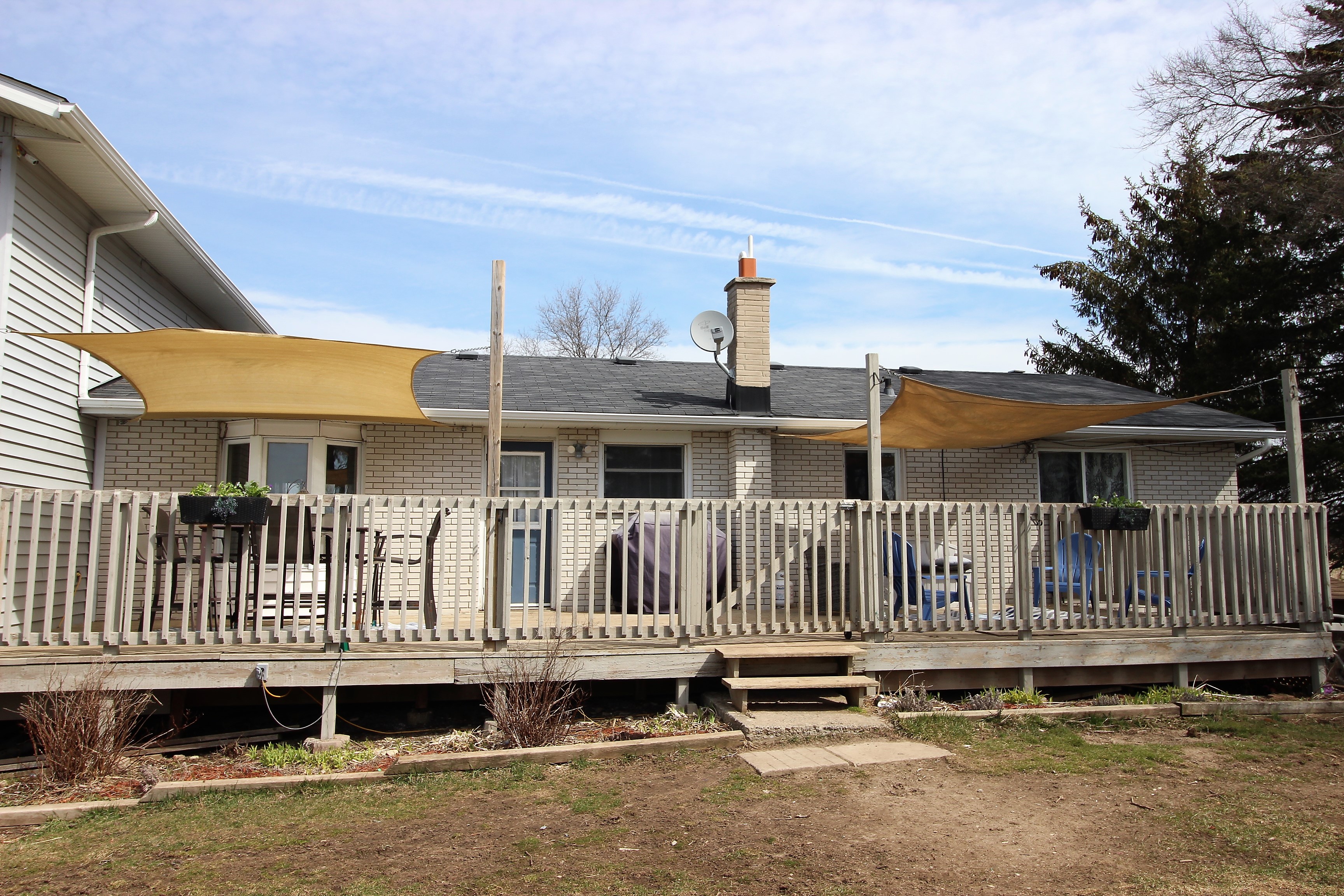 rear deck with sail shades Realty Difference